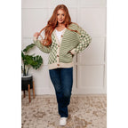 Stay cozy and stylish in our Check the Stripes Knit Cardigan Olive. This versatile piece features a flattering