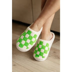 Step your way into comfort with these Checked Out Slippers in green and white. Crafted from a warm fuzzy looped French