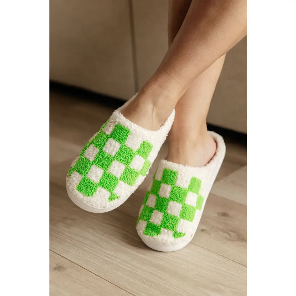 Step your way into comfort with these Checked Out Slippers in green and white. Crafted from a warm fuzzy looped French