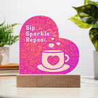 Add sparkle to your coffee bar with this heart-shaped LED acrylic plaque! A bold gift for lovers besties or boutique