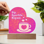 Add sparkle to your coffee bar with this heart-shaped LED acrylic plaque! A bold gift for lovers besties or boutique