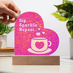 Add sparkle to your coffee bar with this heart-shaped LED acrylic plaque! A bold gift for lovers besties or boutique