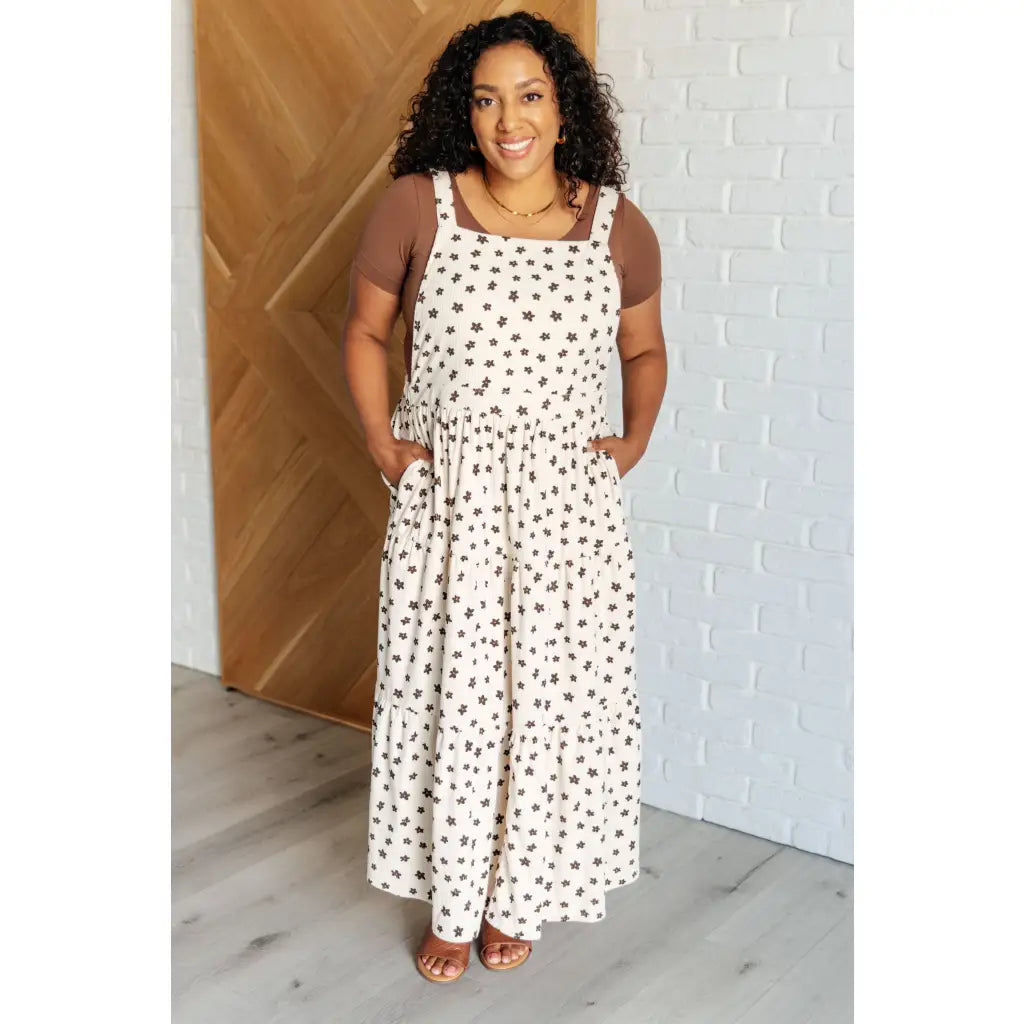 Shop this cream tiered maxi dress with soft corduroy texture and adjustable straps. Available in standard plus sizes