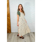 Shop this cream tiered maxi dress with soft corduroy texture and adjustable straps. Available in standard plus sizes