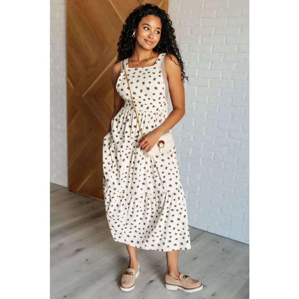 Shop this cream tiered maxi dress with soft corduroy texture and adjustable straps. Available in standard plus sizes