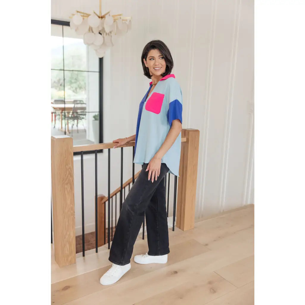 Stand out in the Color Pop Confidence Blouse! Bold color blocking a relaxed fit and luxe style — perfect top