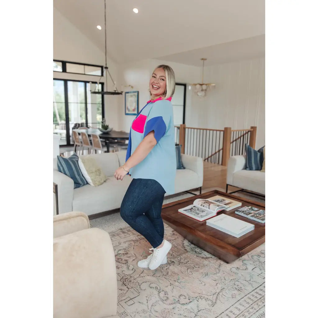 Stand out in the Color Pop Confidence Blouse! Bold color blocking a relaxed fit and luxe style — perfect top