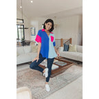Stand out in the Color Pop Confidence Blouse! Bold color blocking a relaxed fit and luxe style — perfect top