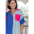 Stand out in the Color Pop Confidence Blouse! Bold color blocking a relaxed fit and luxe style — perfect top
