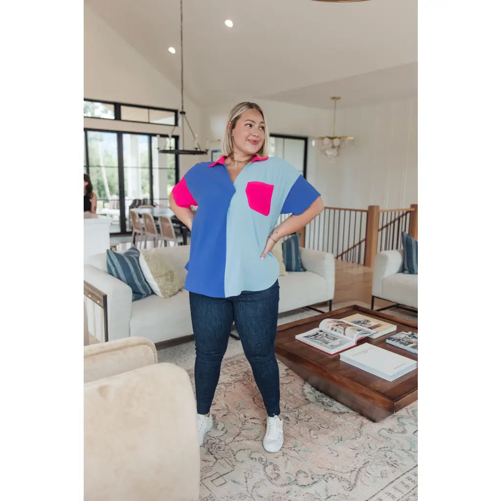Stand out in the Color Pop Confidence Blouse! Bold color blocking a relaxed fit and luxe style — perfect top
