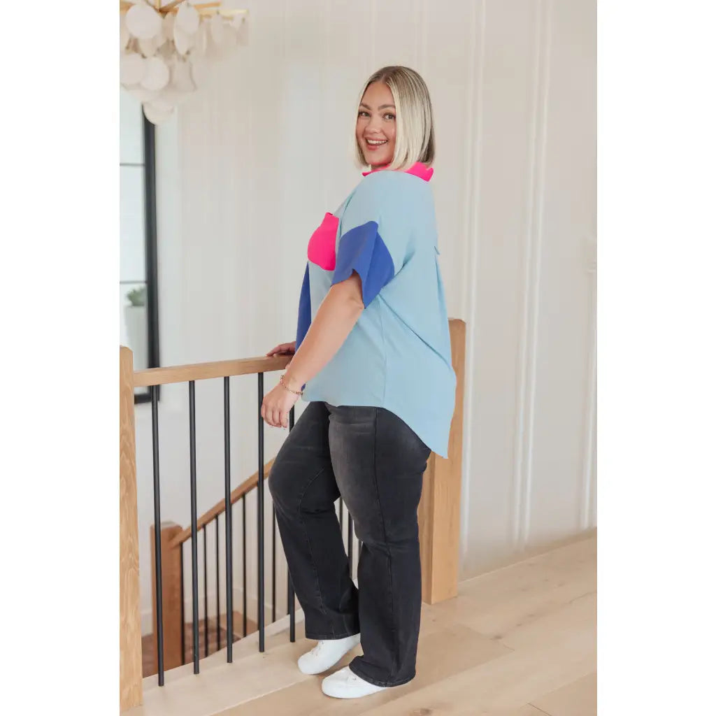 Stand out in the Color Pop Confidence Blouse! Bold color blocking a relaxed fit and luxe style — perfect top