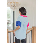 Stand out in the Color Pop Confidence Blouse! Bold color blocking a relaxed fit and luxe style — perfect top