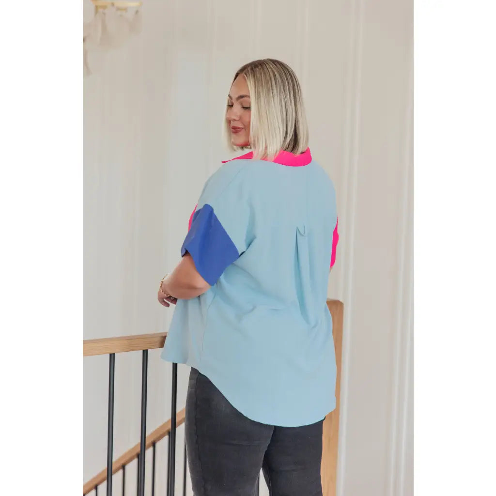 Stand out in the Color Pop Confidence Blouse! Bold color blocking a relaxed fit and luxe style — perfect top