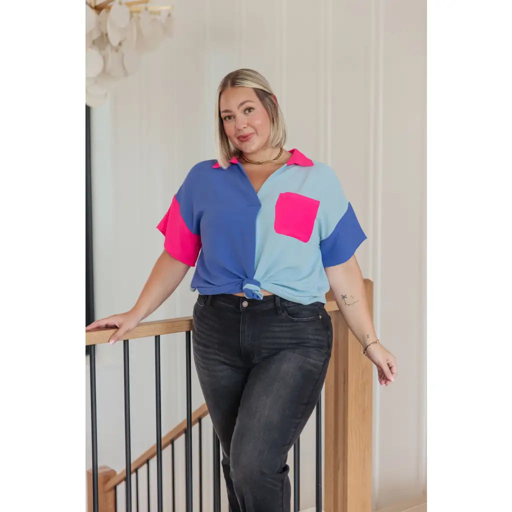 Stand out in the Color Pop Confidence Blouse! Bold color blocking a relaxed fit and luxe style — perfect top