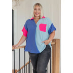 Stand out in the Color Pop Confidence Blouse! Bold color blocking a relaxed fit and luxe style — perfect top