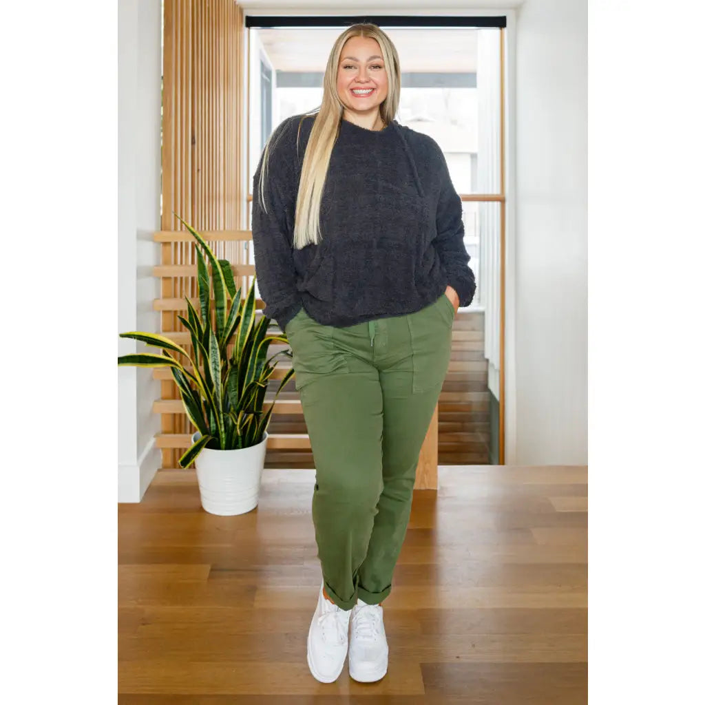 Our Cozy Does It Hoodie In Charcoal is so comfy! The coziness starts with a fuzzy medium weight knit that shapes slight