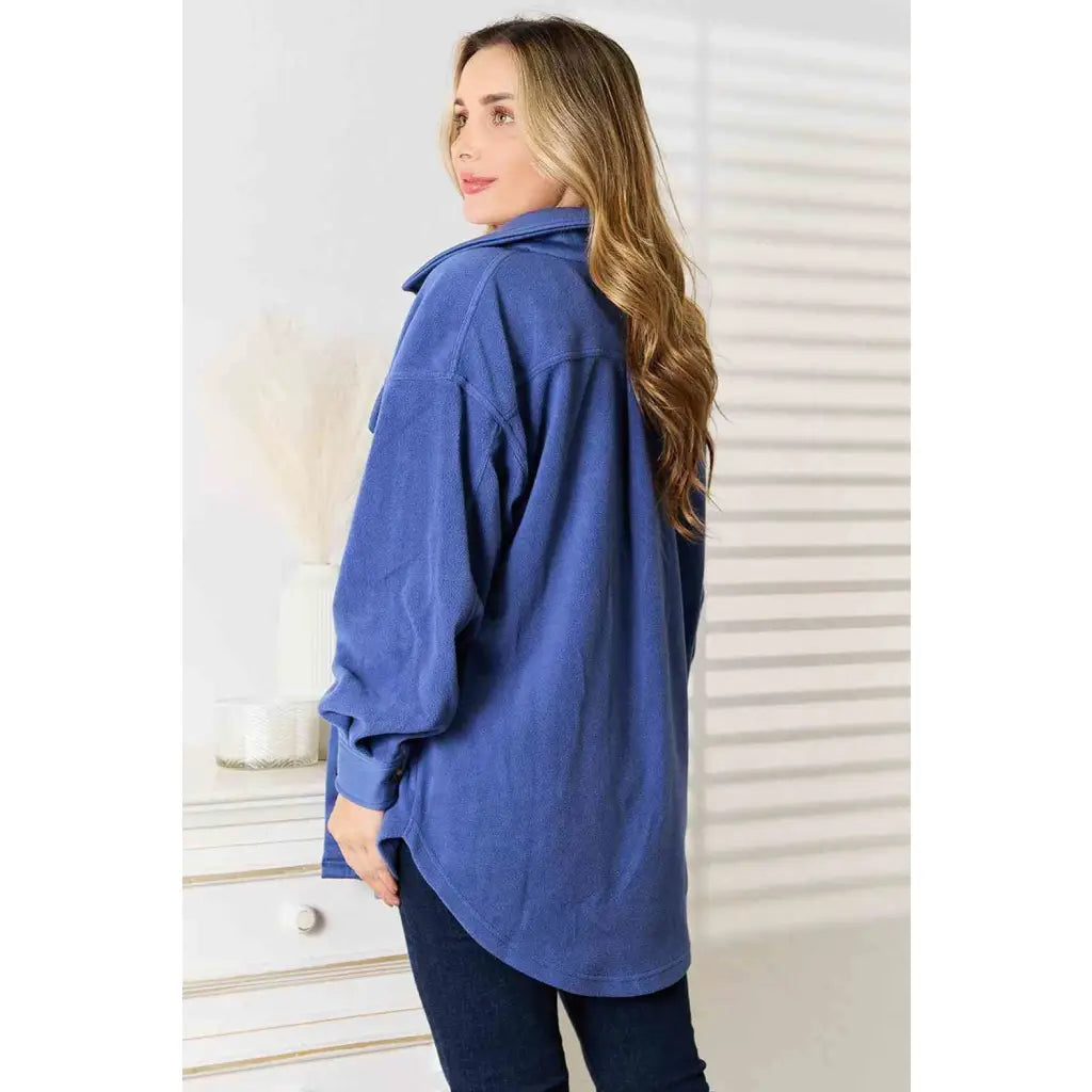 Our Cozy Girl Shacket in Dusty Blue features a unique tunic detail front and side pockets trendy long puff sleeves.