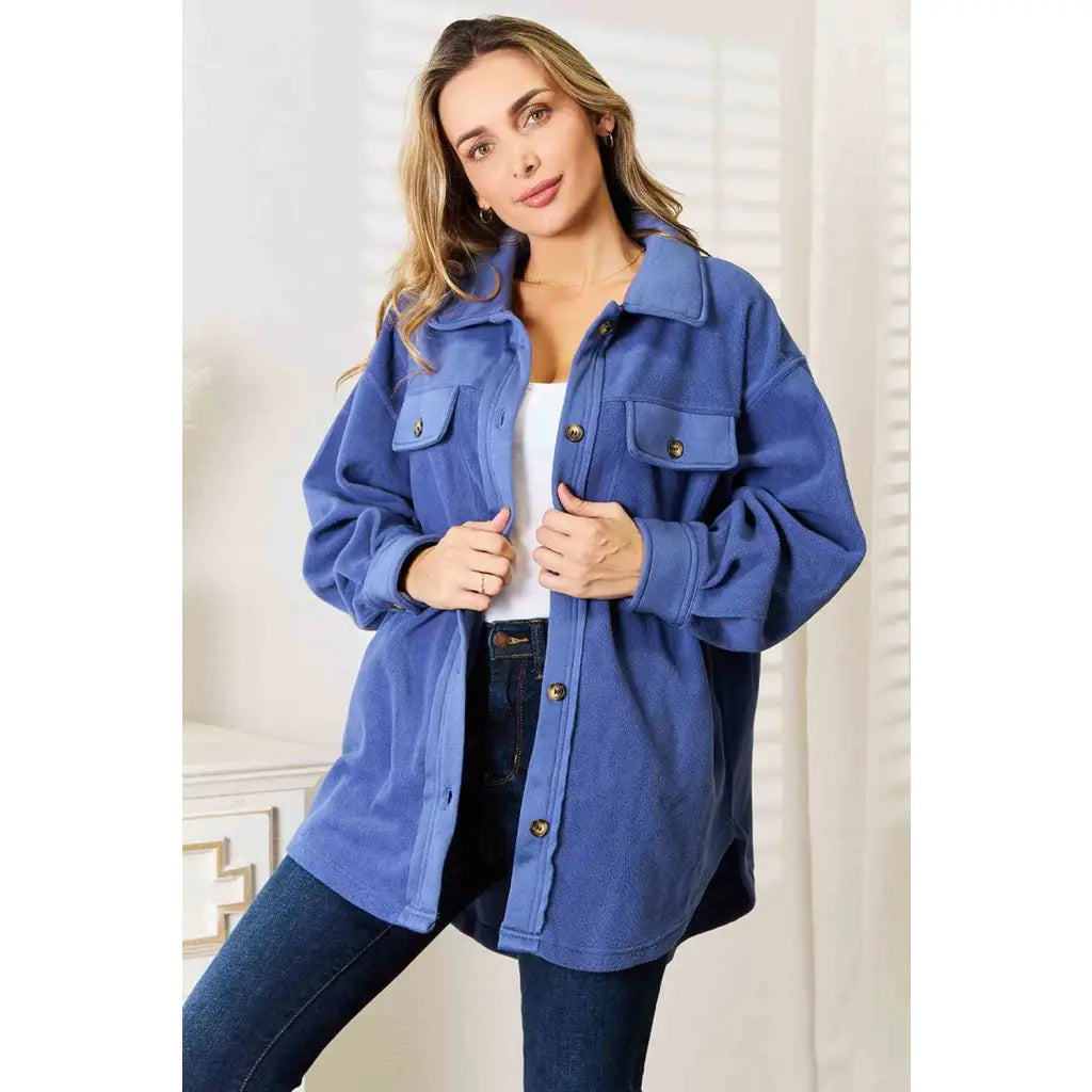 Our Cozy Girl Shacket in Dusty Blue features a unique tunic detail front and side pockets trendy long puff sleeves.