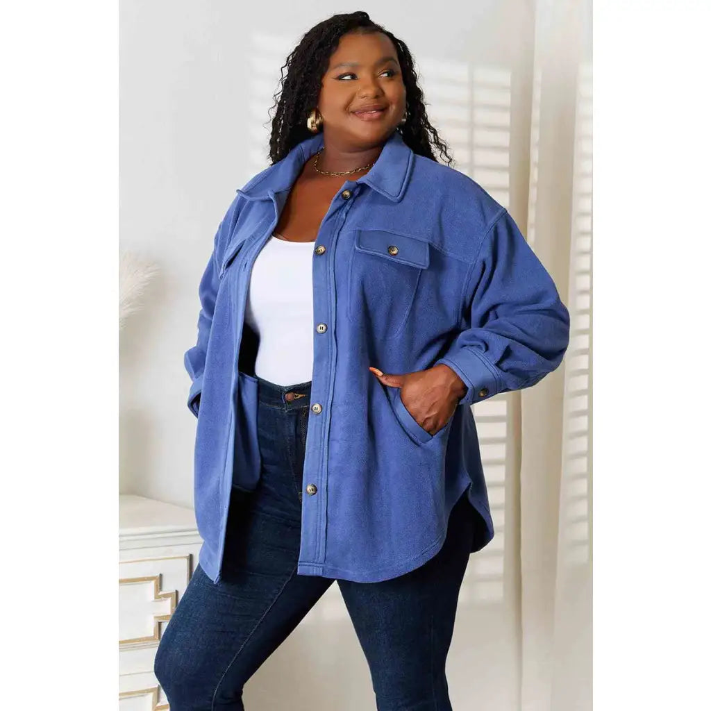 Our Cozy Girl Shacket in Dusty Blue features a unique tunic detail front and side pockets trendy long puff sleeves.
