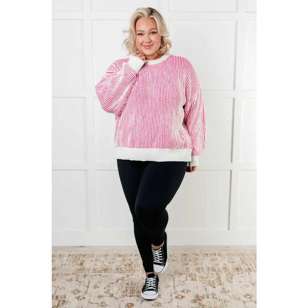 Our Cozy Oversized Contrast Trim Sweater in Pink and White features a textured knit banded ribbed details on the round