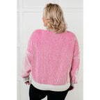 Our Cozy Oversized Contrast Trim Sweater in Pink and White features a textured knit banded ribbed details on the round