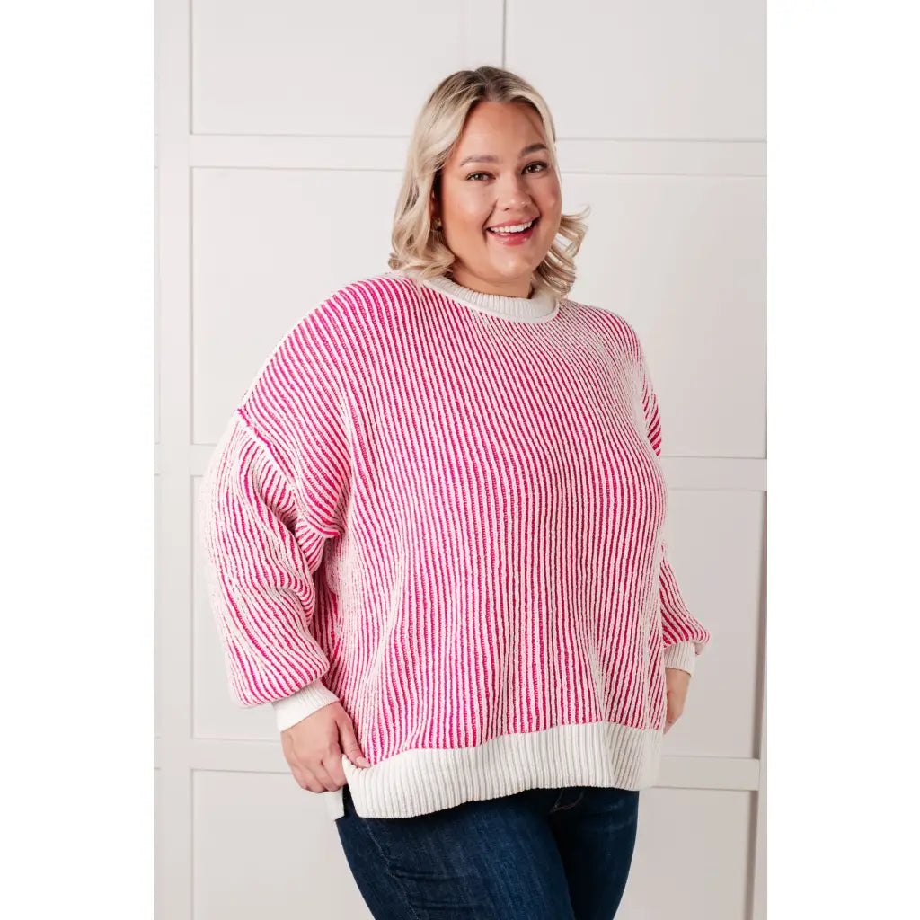 Our Cozy Oversized Contrast Trim Sweater in Pink and White features a textured knit banded ribbed details on the round
