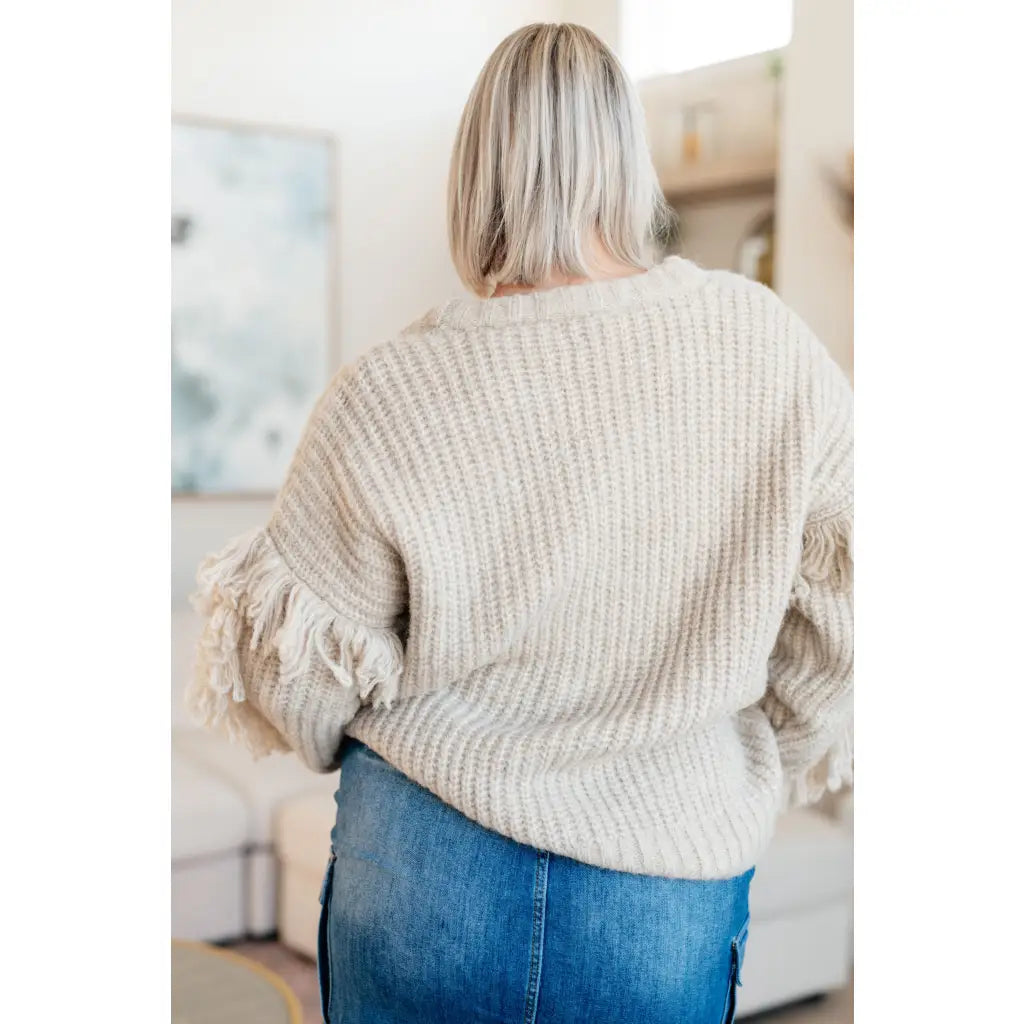 Fringe knit cardigan with button front and V-neckline. Plus sizes available. Cozy boutique layering piece playful