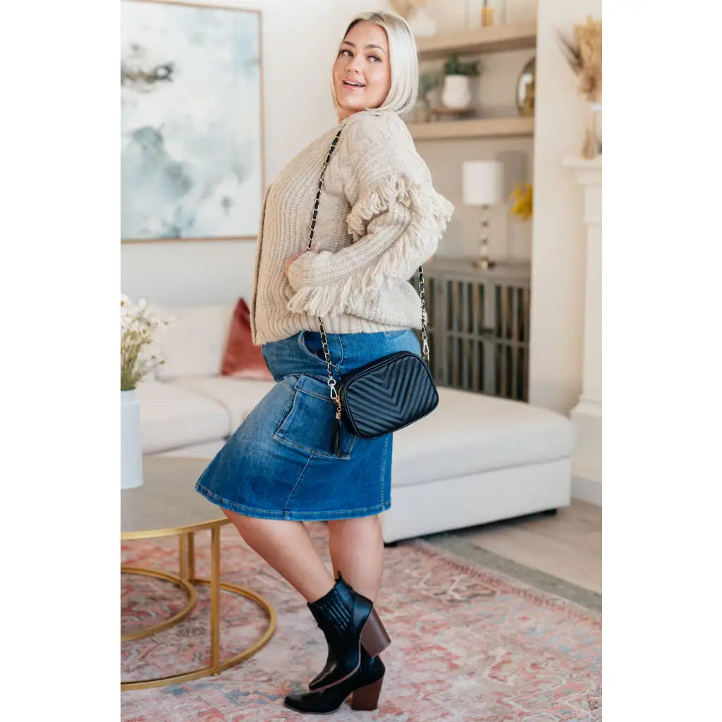 Fringe knit cardigan with button front and V-neckline. Plus sizes available. Cozy boutique layering piece playful