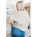 Fringe knit cardigan with button front and V-neckline. Plus sizes available. Cozy boutique layering piece playful