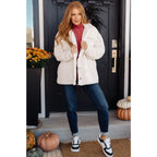 Stay cozy and chic with our Cuddly Sherpa Coat in Cream. Soft fleece jacket perfect for layering on chilly days.