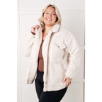 Stay cozy and chic with our Cuddly Sherpa Coat in Cream. Soft fleece jacket perfect for layering on chilly days.
