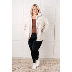 Stay cozy and chic with our Cuddly Sherpa Coat in Cream. Soft fleece jacket perfect for layering on chilly days.