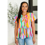 Bold swirl puff sleeve top in mint and orange. No-stretch woven fit with bows a gathered tier. Available regular plus