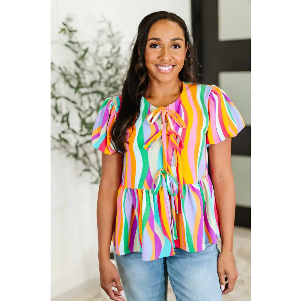 Bold swirl puff sleeve top in mint and orange. No-stretch woven fit with bows a gathered tier. Available regular plus