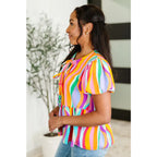 Bold swirl puff sleeve top in mint and orange. No-stretch woven fit with bows a gathered tier. Available regular plus