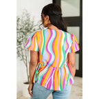 Bold swirl puff sleeve top in mint and orange. No-stretch woven fit with bows a gathered tier. Available regular plus