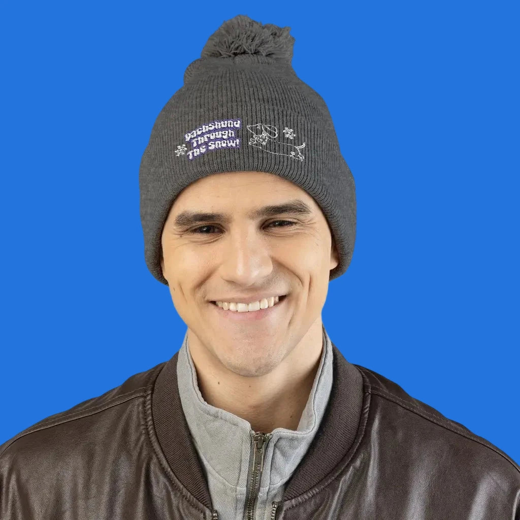 Cozy embroidered beanie with dachshund art by Sweet Roo Bou. A playful winter hat in six colors for dog lovers and fun