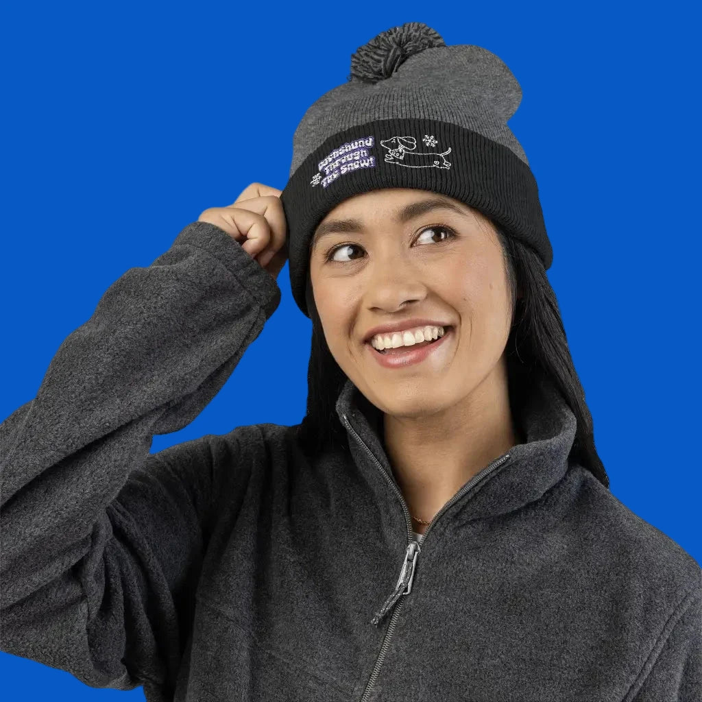 Cozy embroidered beanie with dachshund art by Sweet Roo Bou. A playful winter hat in six colors for dog lovers and fun