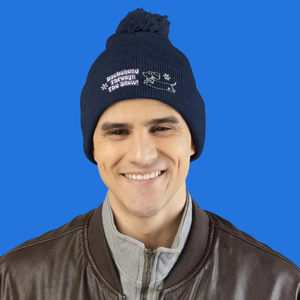 Cozy embroidered beanie with dachshund art by Sweet Roo Bou. A playful winter hat in six colors for dog lovers and fun