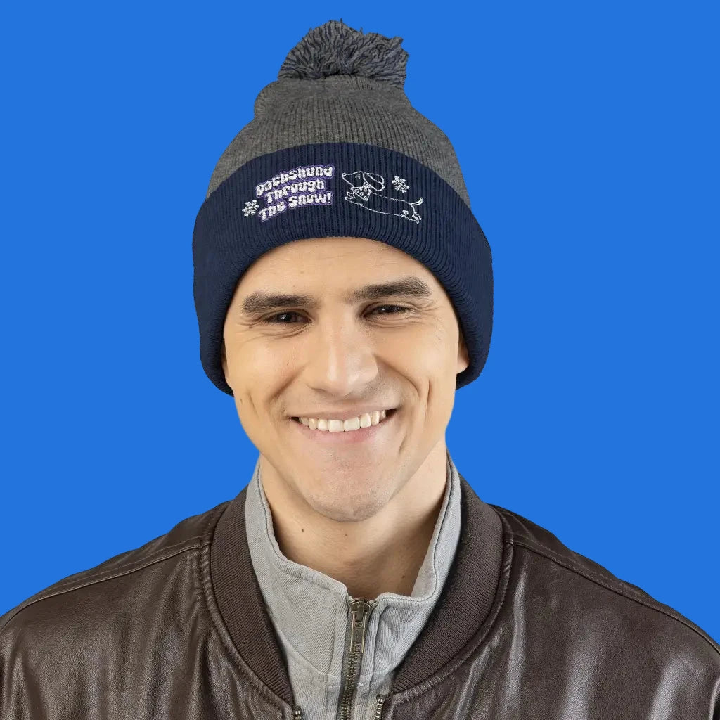 Cozy embroidered beanie with dachshund art by Sweet Roo Bou. A playful winter hat in six colors for dog lovers and fun