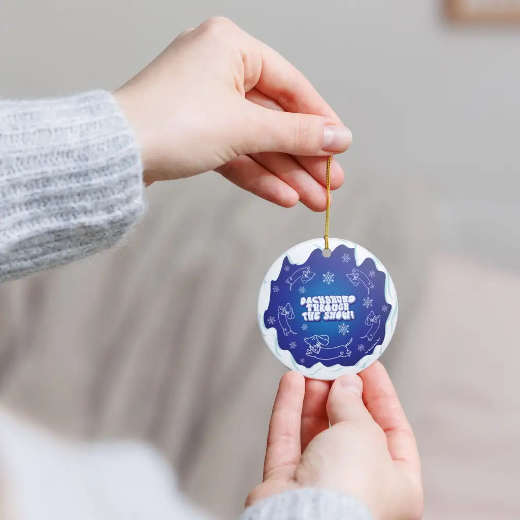 Exclusive Sweet Roo Bou™ ceramic ornament with dachshund art. A glossy giftable keepsake for dog lovers and holiday