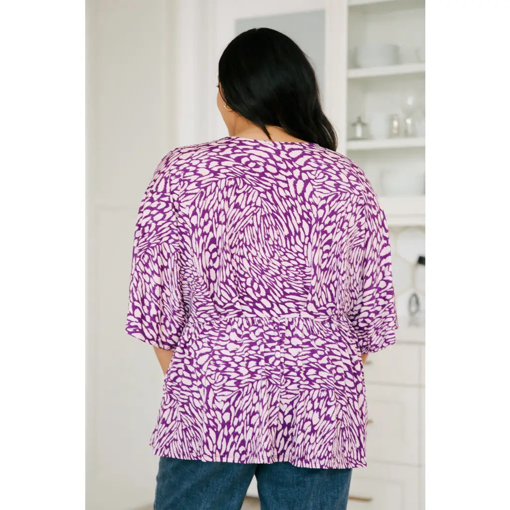 Look stylish in our Dearest Dreamer Peplum Top Painted Purple. Crafted from beautifully printed and easy to wear