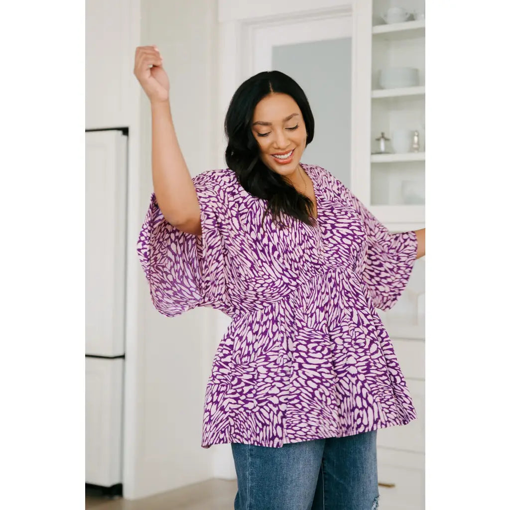 Look stylish in our Dearest Dreamer Peplum Top Painted Purple. Crafted from beautifully printed and easy to wear