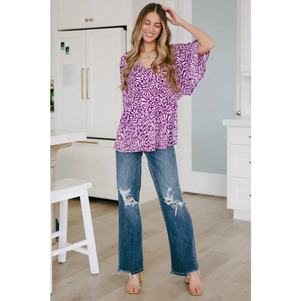 Look stylish in our Dearest Dreamer Peplum Top Painted Purple. Crafted from beautifully printed and easy to wear
