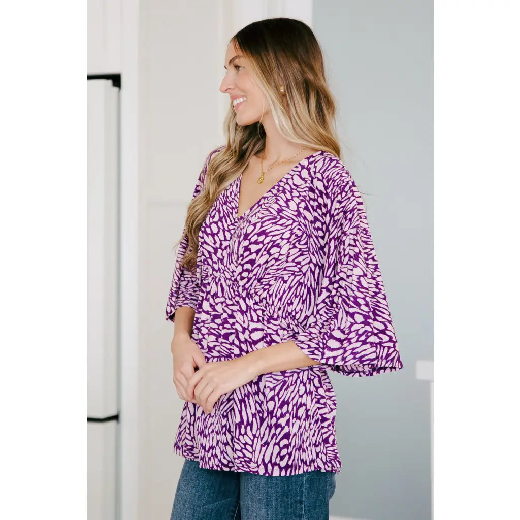 Look stylish in our Dearest Dreamer Peplum Top Painted Purple. Crafted from beautifully printed and easy to wear