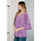 Look stylish in our Dearest Dreamer Peplum Top Painted Purple. Crafted from beautifully printed and easy to wear