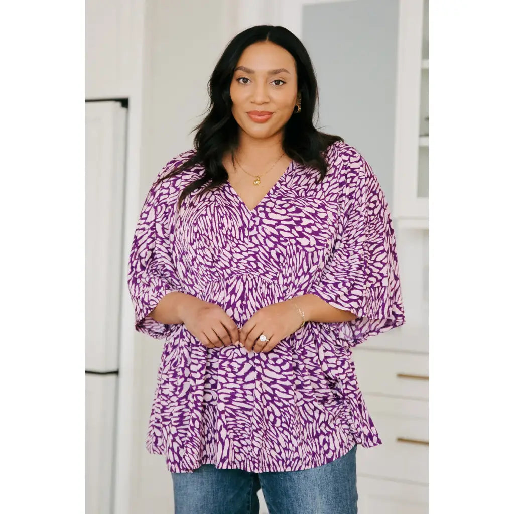 Look stylish in our Dearest Dreamer Peplum Top Painted Purple. Crafted from beautifully printed and easy to wear