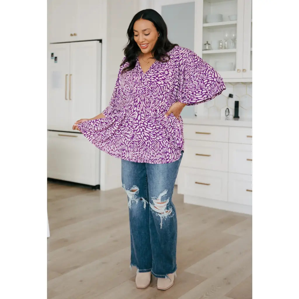 Look stylish in our Dearest Dreamer Peplum Top Painted Purple. Crafted from beautifully printed and easy to wear