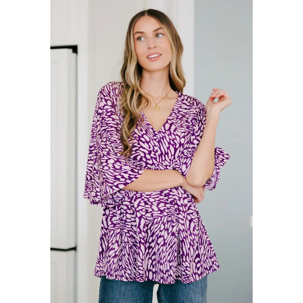 Look stylish in our Dearest Dreamer Peplum Top Painted Purple. Crafted from beautifully printed and easy to wear