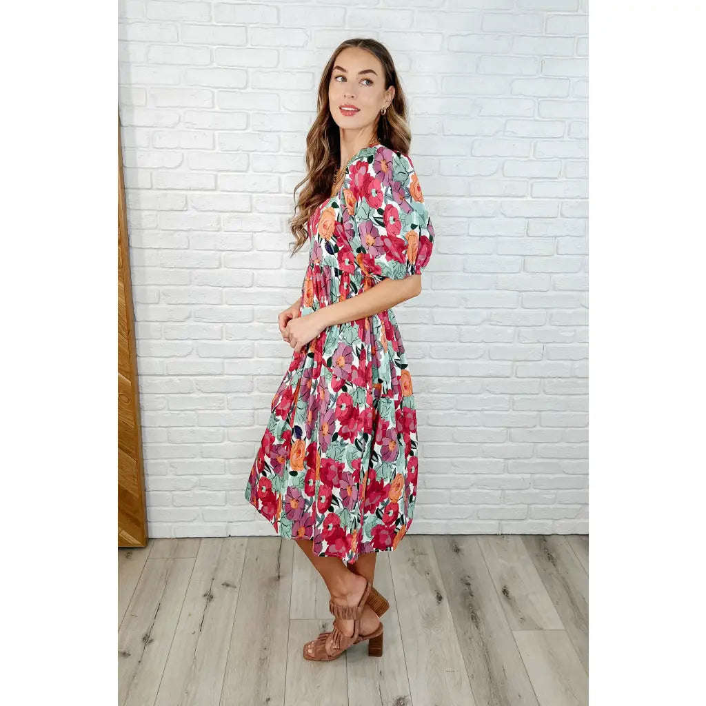 Turn heads in the Delightful Blooms Puff Sleeve Floral Midi Dress. A vibrant flattering plus size dress perfect